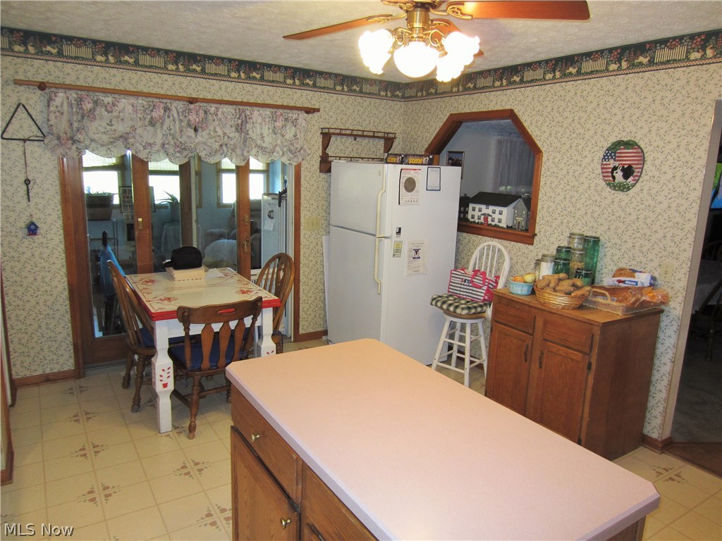 24021 Foster Road Litchfield, OH 44253 - Photo 10 of 34 Off the kitchen is the enclosed 4 season room!