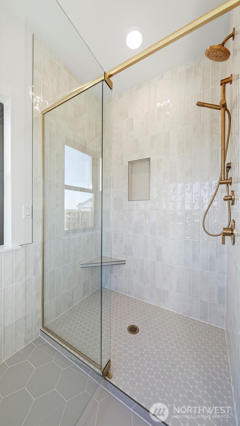 511 Southwest 12th Street College Place, WA 99324 - Photo 12 of 21 a bathroom that has a glass shower door