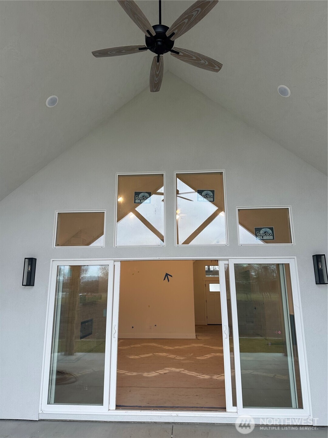 511 Southwest 12th Street College Place, WA 99324 - Photo 13 of 31 a view of a hallway with wooden floor and a ceiling fan