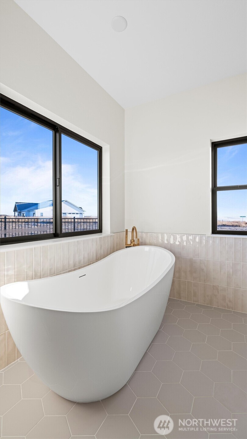 511 Southwest 12th Street College Place, WA 99324 - Photo 14 of 21 a white tub sitting in a room