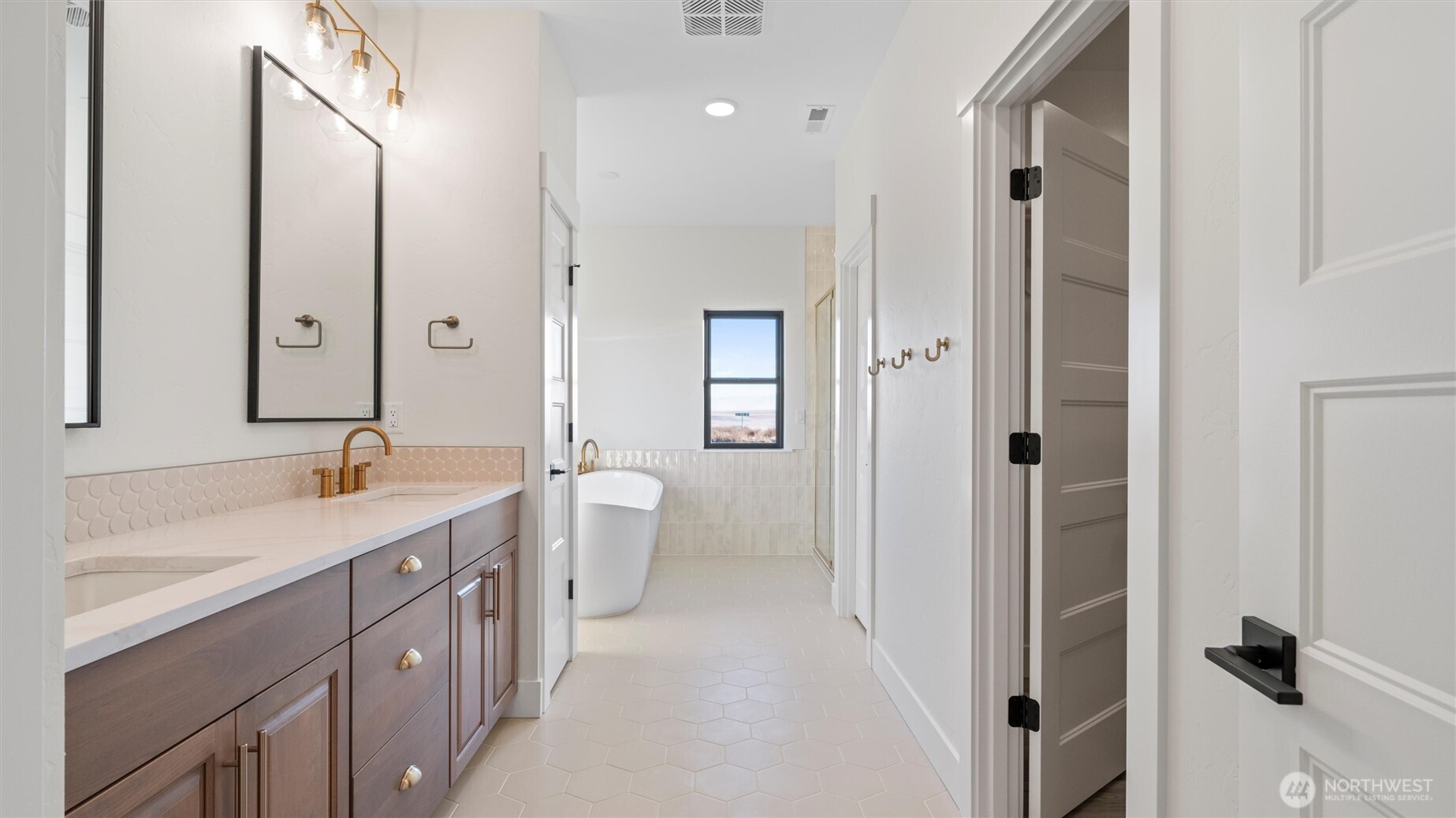 511 Southwest 12th Street College Place, WA 99324 - Photo 16 of 21 a spacious bathroom with a double vanity sink a toilet and a shower