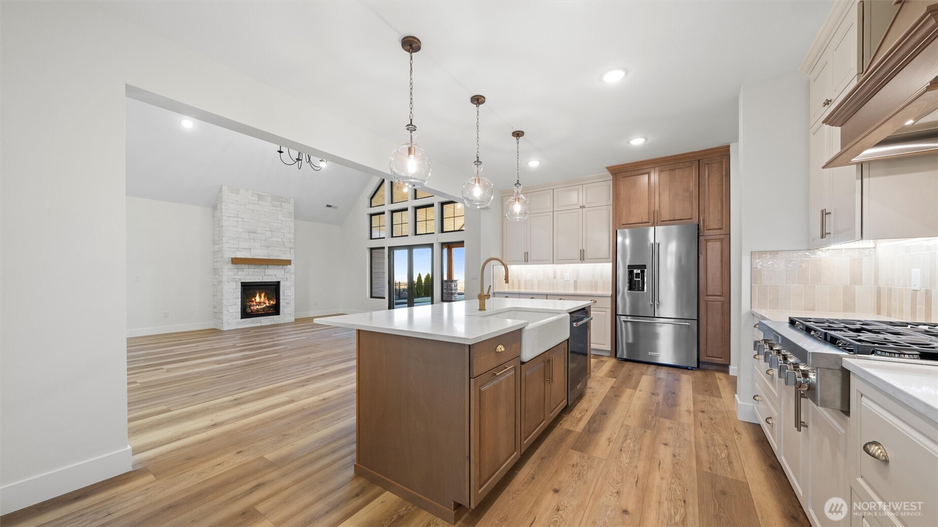 511 Southwest 12th Street College Place, WA 99324 - Photo 8 of 21 a kitchen with stainless steel appliances granite countertop a stove and a refrigerator