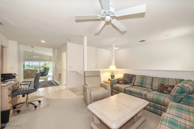 a spacious bedroom with a bed and a large window