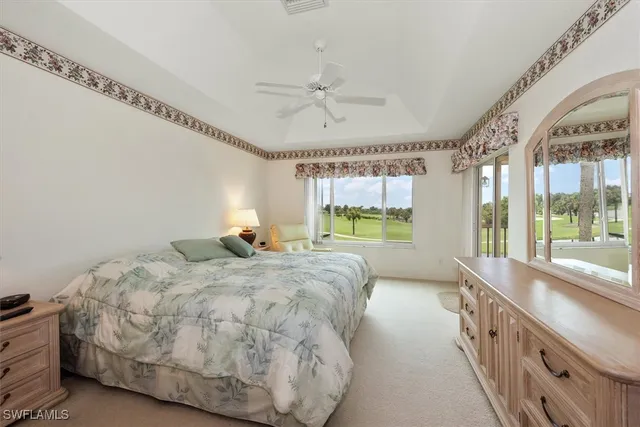 a large bedroom with a large bed and a view of bedroom