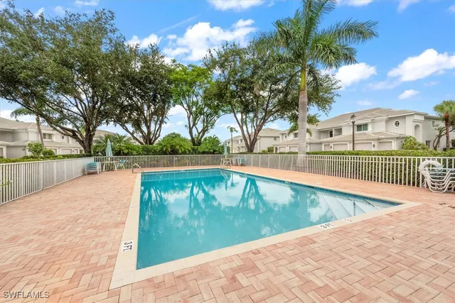 a view of a golf course with a lake view