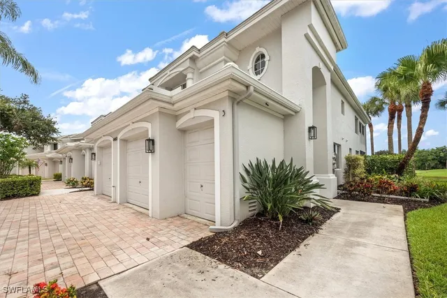 a kitchen with a sink window and cabinets