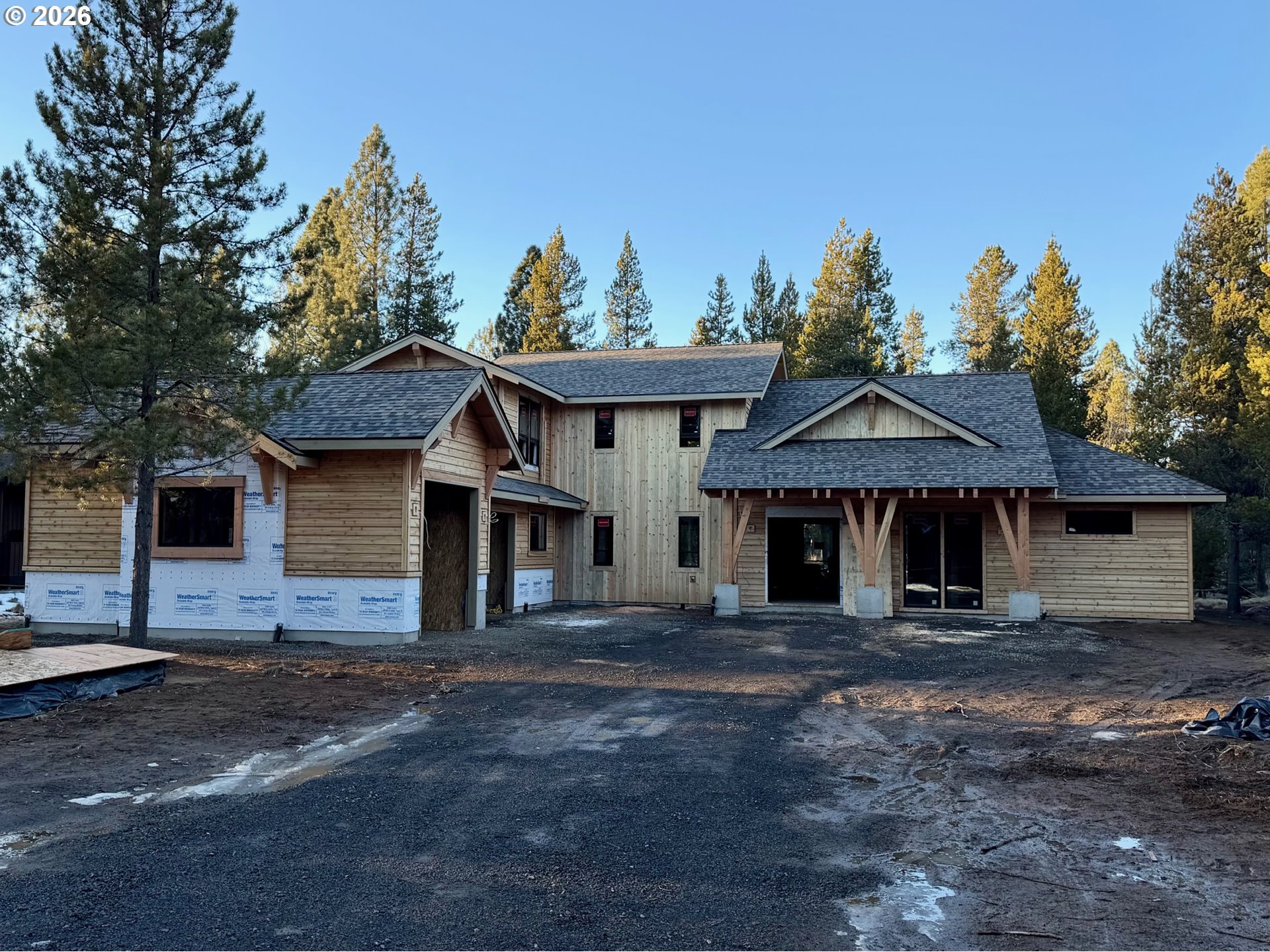 56322 Fireglass Loop Bend, OR 97707 - Photo 1 of 5 a front view of a house with a garden