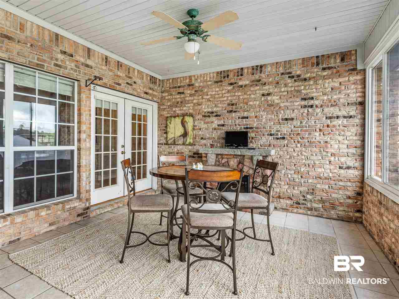 9095 Bay Point Drive Elberta, AL 36530 - Photo 33 of 49 Sunroom with fireplace. Year round room!