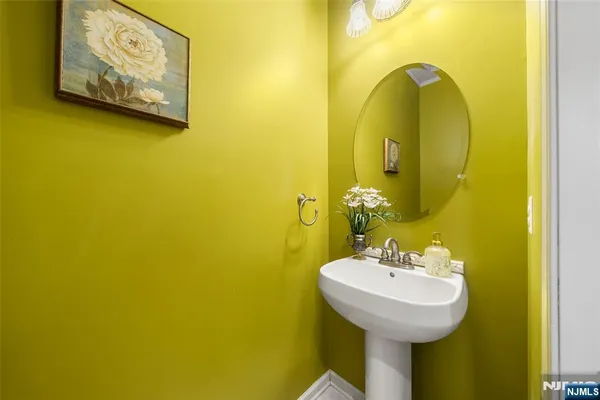 a bathroom with a sink and mirror