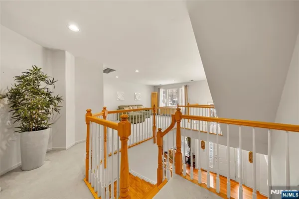 a view of a hallway with seating area