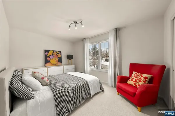 a bedroom with a bed and a couch