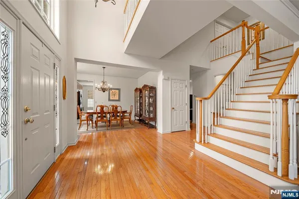 a view of a livingroom with furniture and hardwood floor