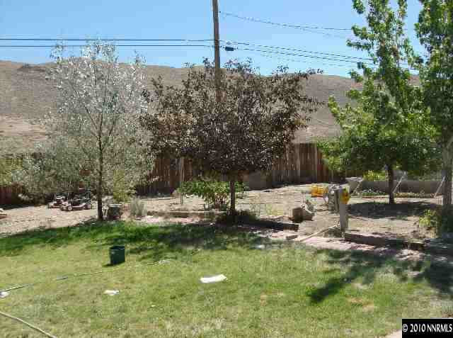 3840 Bittern Court Reno, NV 89508 - Photo 4 of 5 a view of a garden with a bench