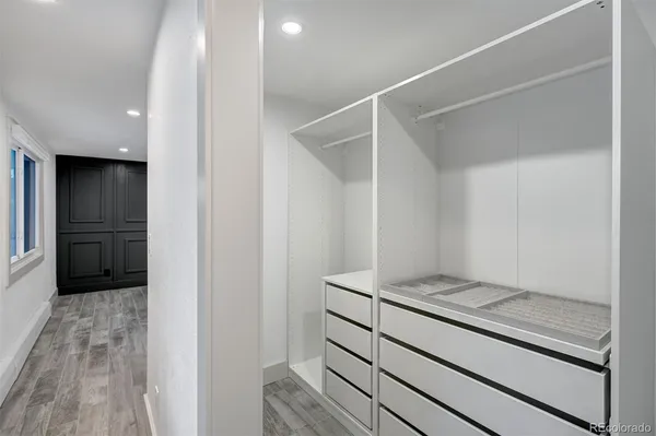 a view of kitchen with refrigerator and window