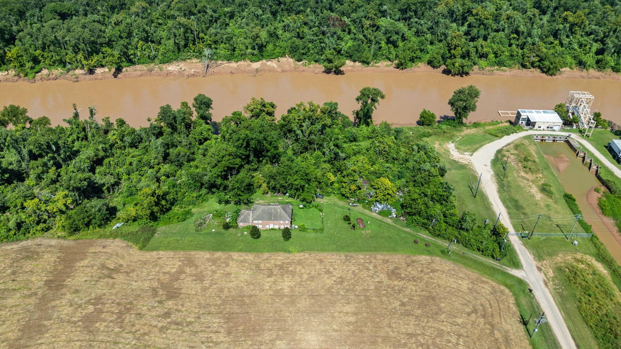 3505 Miller Road Rosharon, TX 77583 - Photo 11 of 15 a view of a lake with a yard and large trees