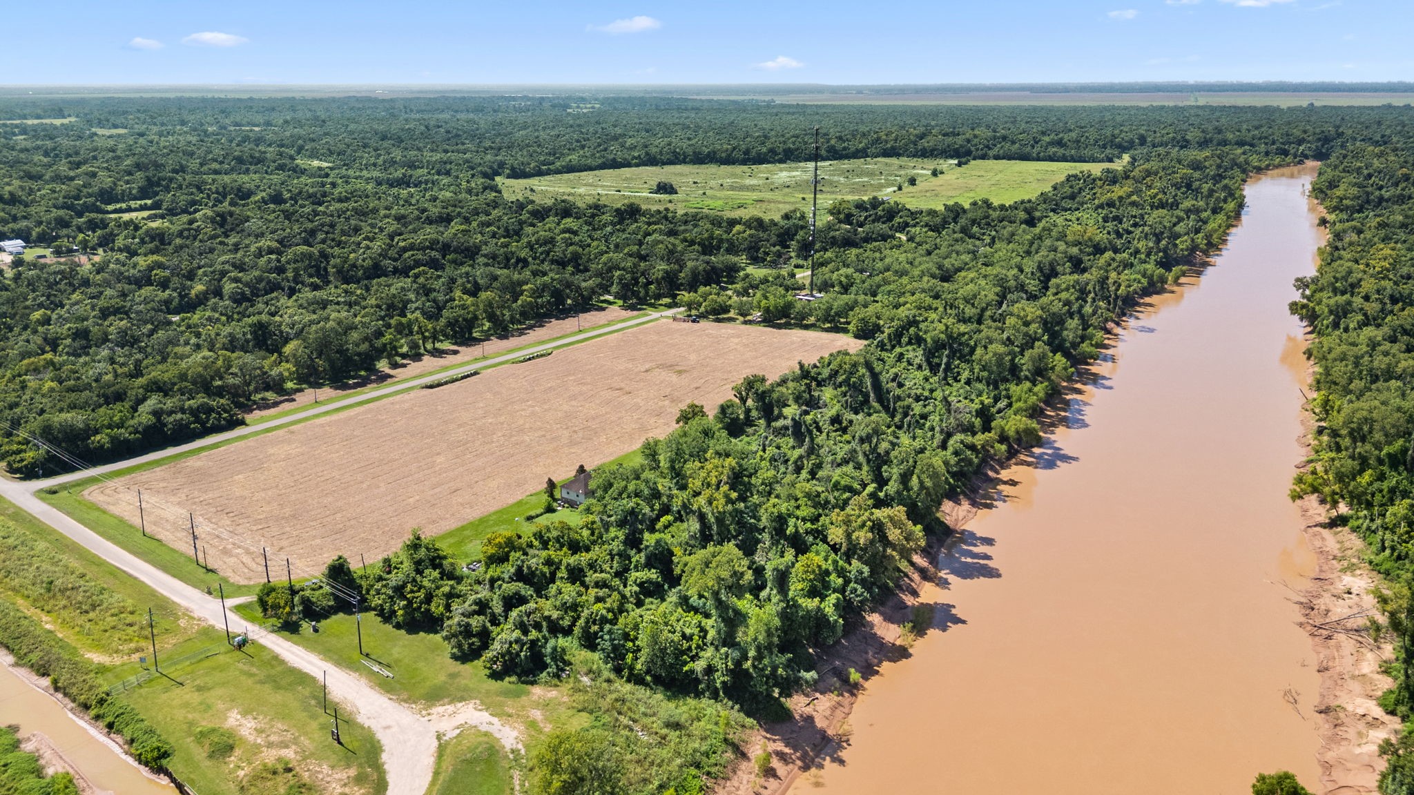 3505 Miller Road Rosharon, TX 77583 - Photo 5 of 15 a view of a lake with a yard