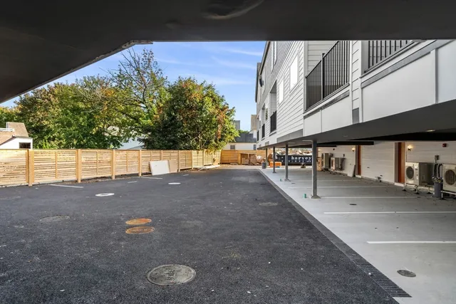 a view of a street with a building in the background
