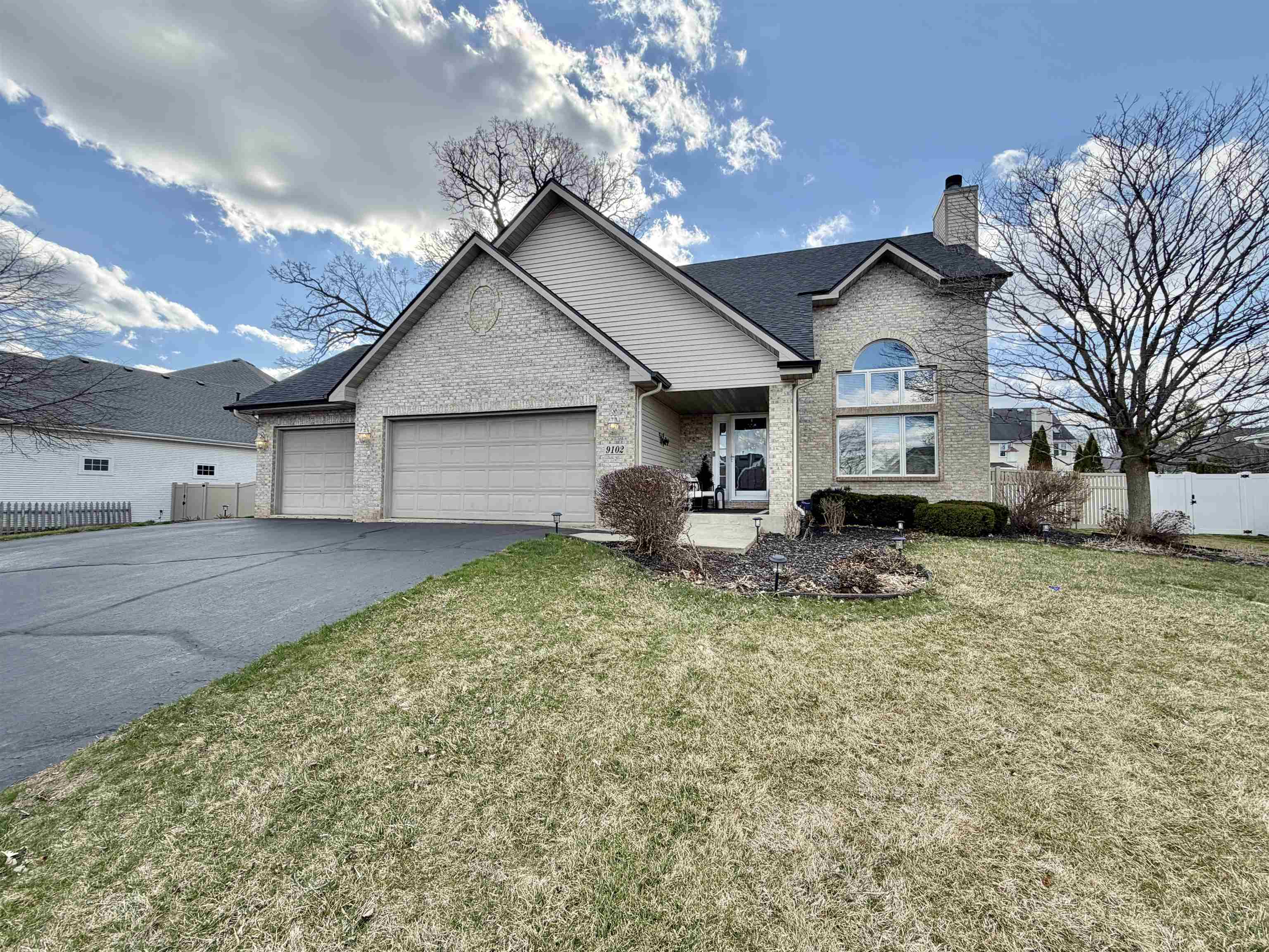 9102 River View Trail Roscoe, IL 61073 - Photo 1 of 40 a house view with a garden space