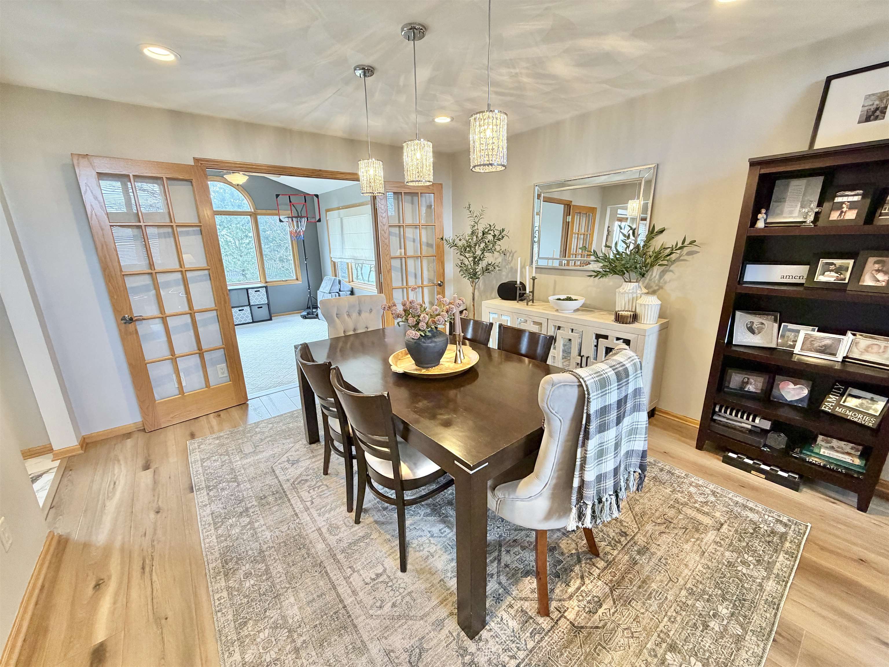 9102 River View Trail Roscoe, IL 61073 - Photo 12 of 40 a view of a dining room with furniture and wooden floor