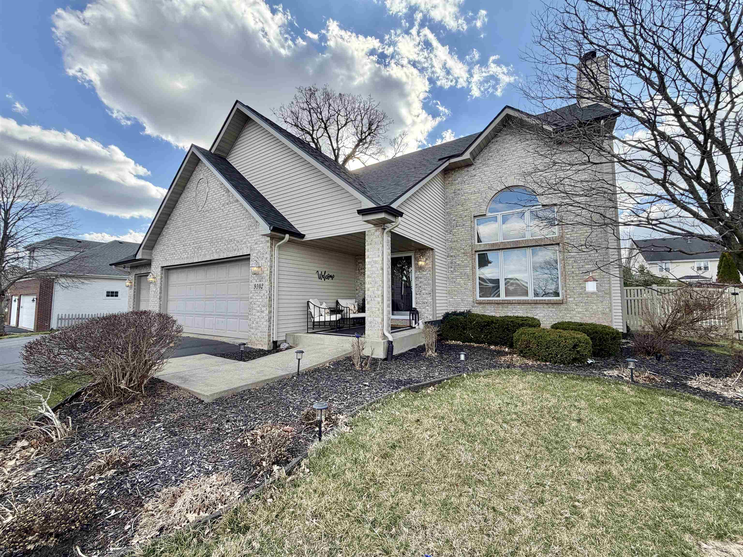 9102 River View Trail Roscoe, IL 61073 - Photo 2 of 40 a view of a house with a patio