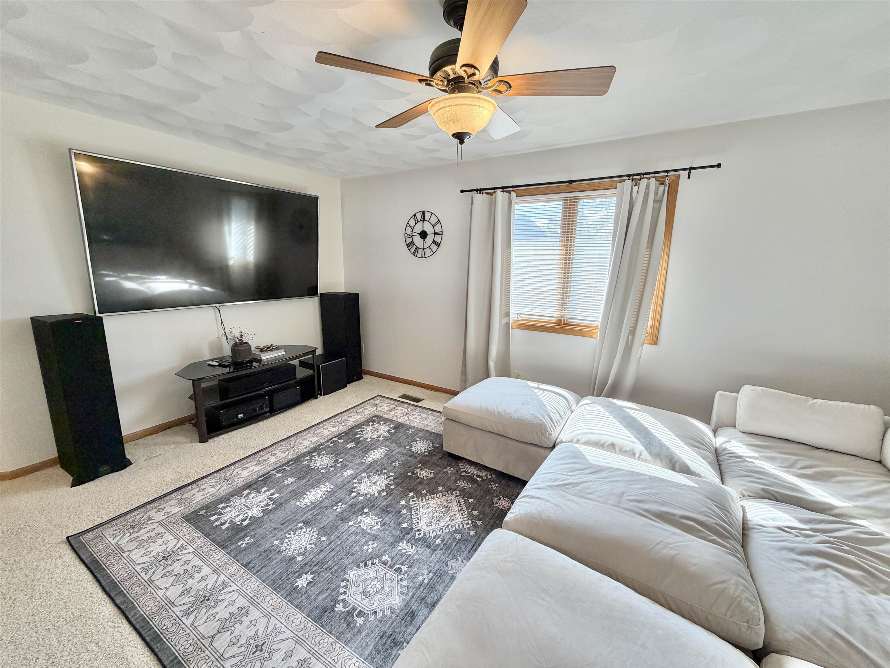 9102 River View Trail Roscoe, IL 61073 - Photo 22 of 40 a bedroom with a bed and a flat screen tv