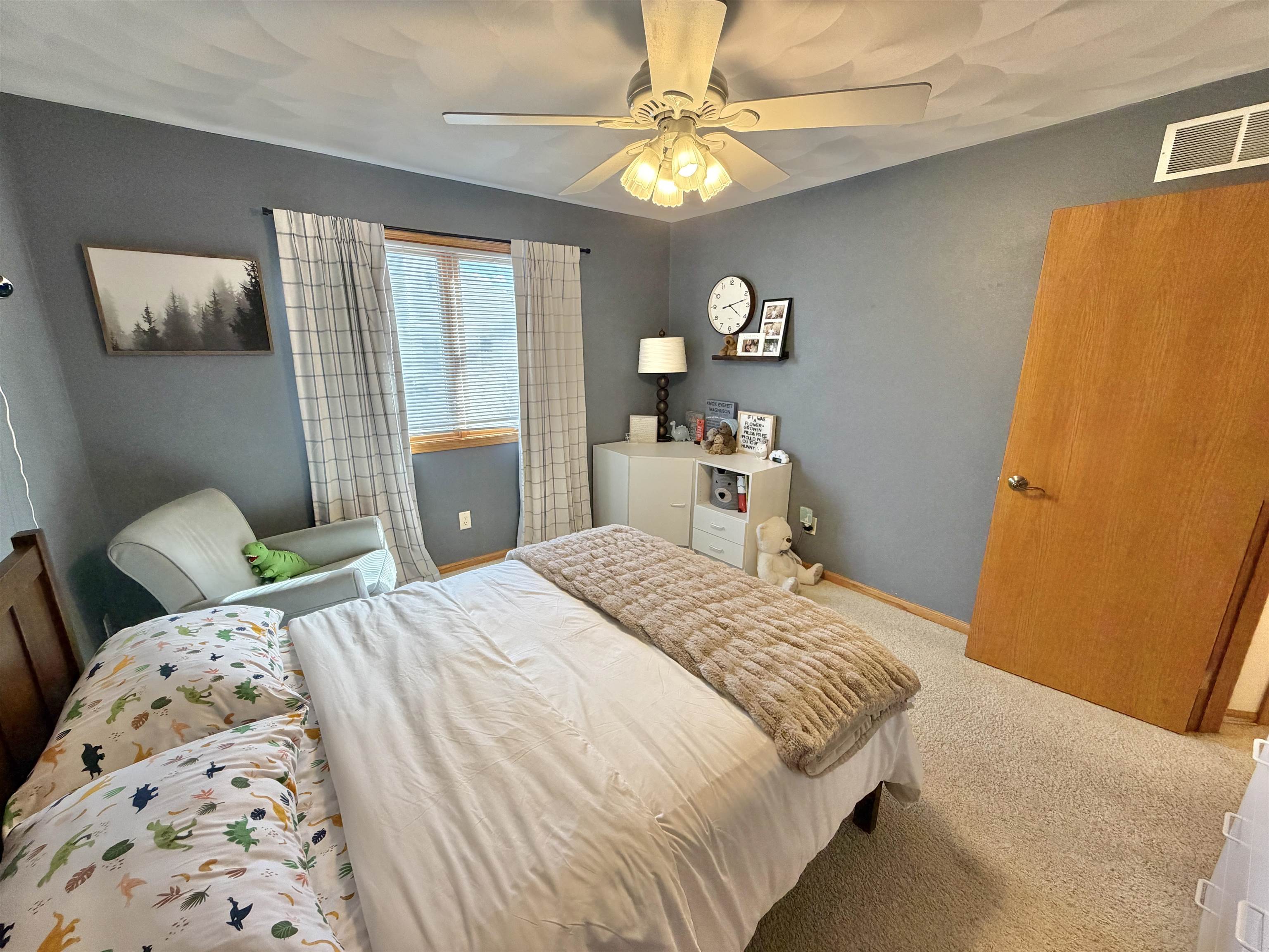 9102 River View Trail Roscoe, IL 61073 - Photo 23 of 40 a bedroom with a bed dresser and a window