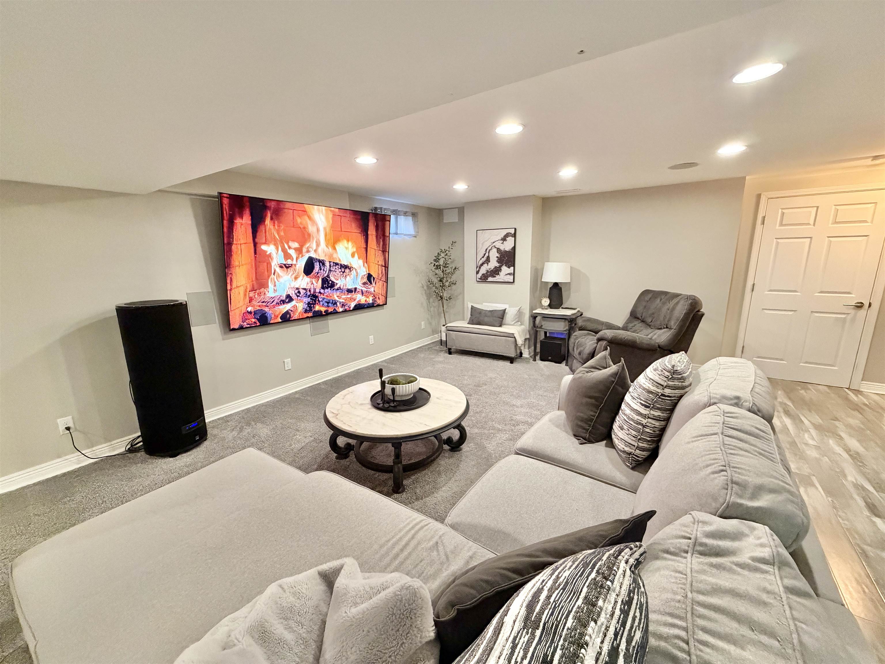 9102 River View Trail Roscoe, IL 61073 - Photo 28 of 40 a living room with furniture and a flat screen tv