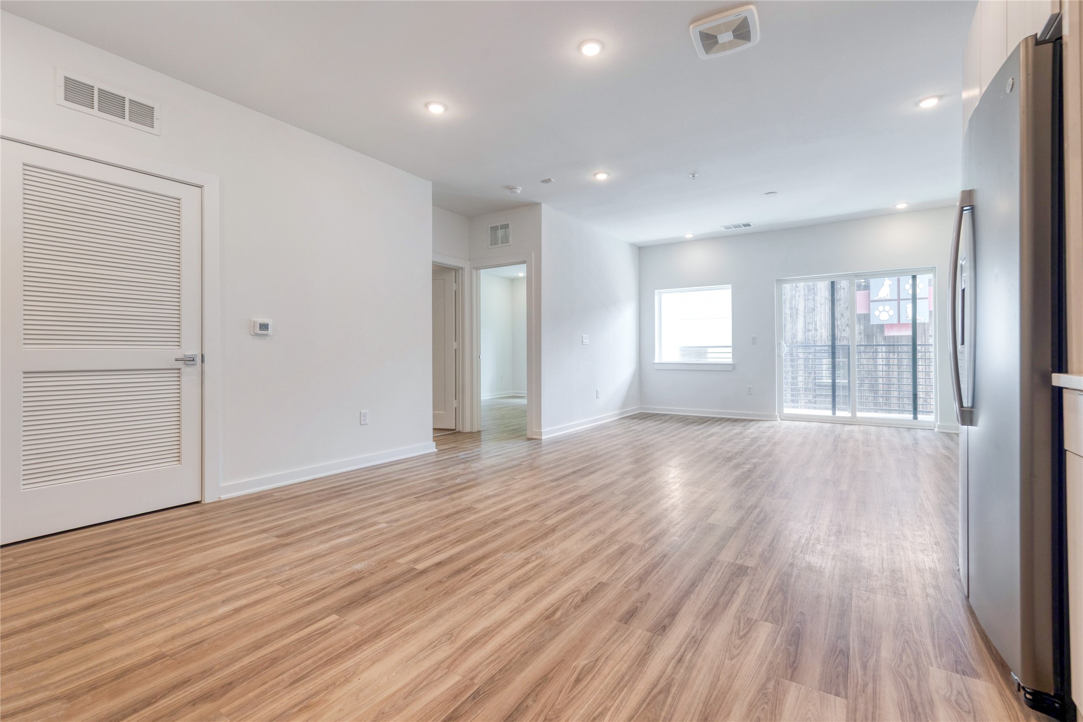 4802 South Congress Avenue, Unit 217 Austin, TX 78745 - Photo 5 of 33 Empty room featuring light wood-type flooring and recessed lighting