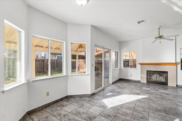 a view of an empty room with a fireplace