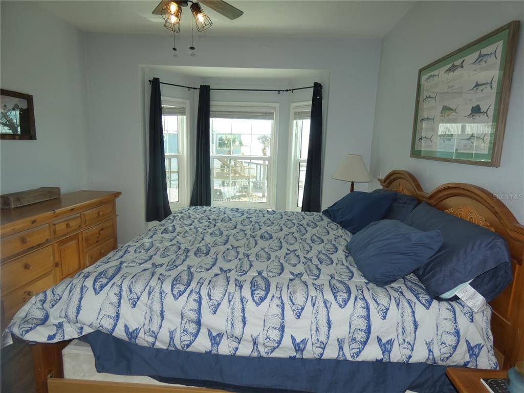 502 Main Street, Unit 106 Horseshoe Beach, FL 32648 - Photo 13 of 27 a bedroom with a bed and a window