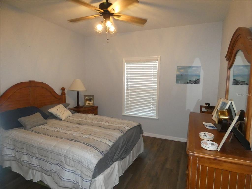 502 Main Street, Unit 106 Horseshoe Beach, FL 32648 - Photo 16 of 27 a bedroom with a bed and a tv