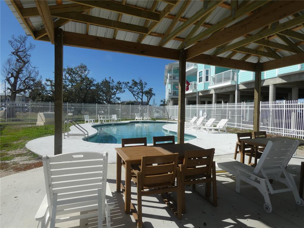 502 Main Street, Unit 106 Horseshoe Beach, FL 32648 - Photo 25 of 27 a view of a patio with chairs and table in the patio