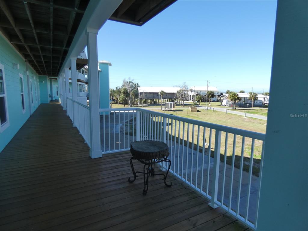 502 Main Street, Unit 106 Horseshoe Beach, FL 32648 - Photo 4 of 27 a view of a balcony with furniture