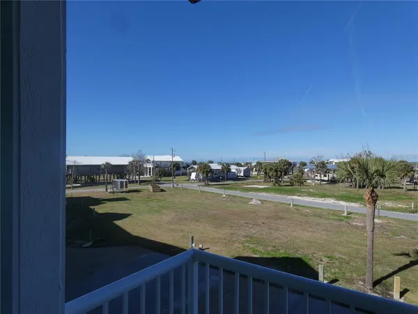 a view of an ocean and city from a balcony