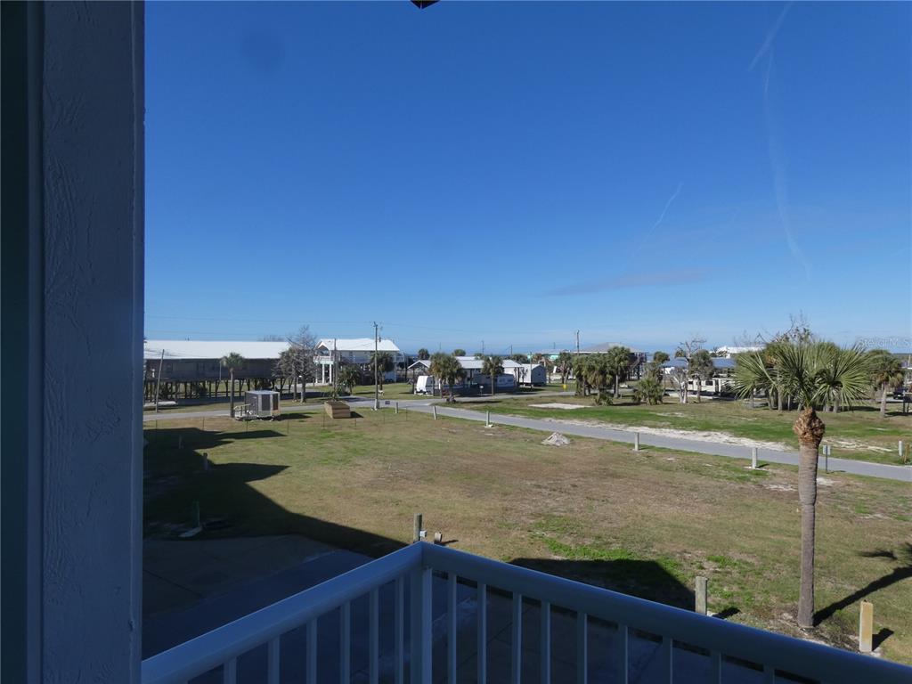502 Main Street, Unit 106 Horseshoe Beach, FL 32648 - Photo 5 of 27 a view of an ocean and city from a balcony