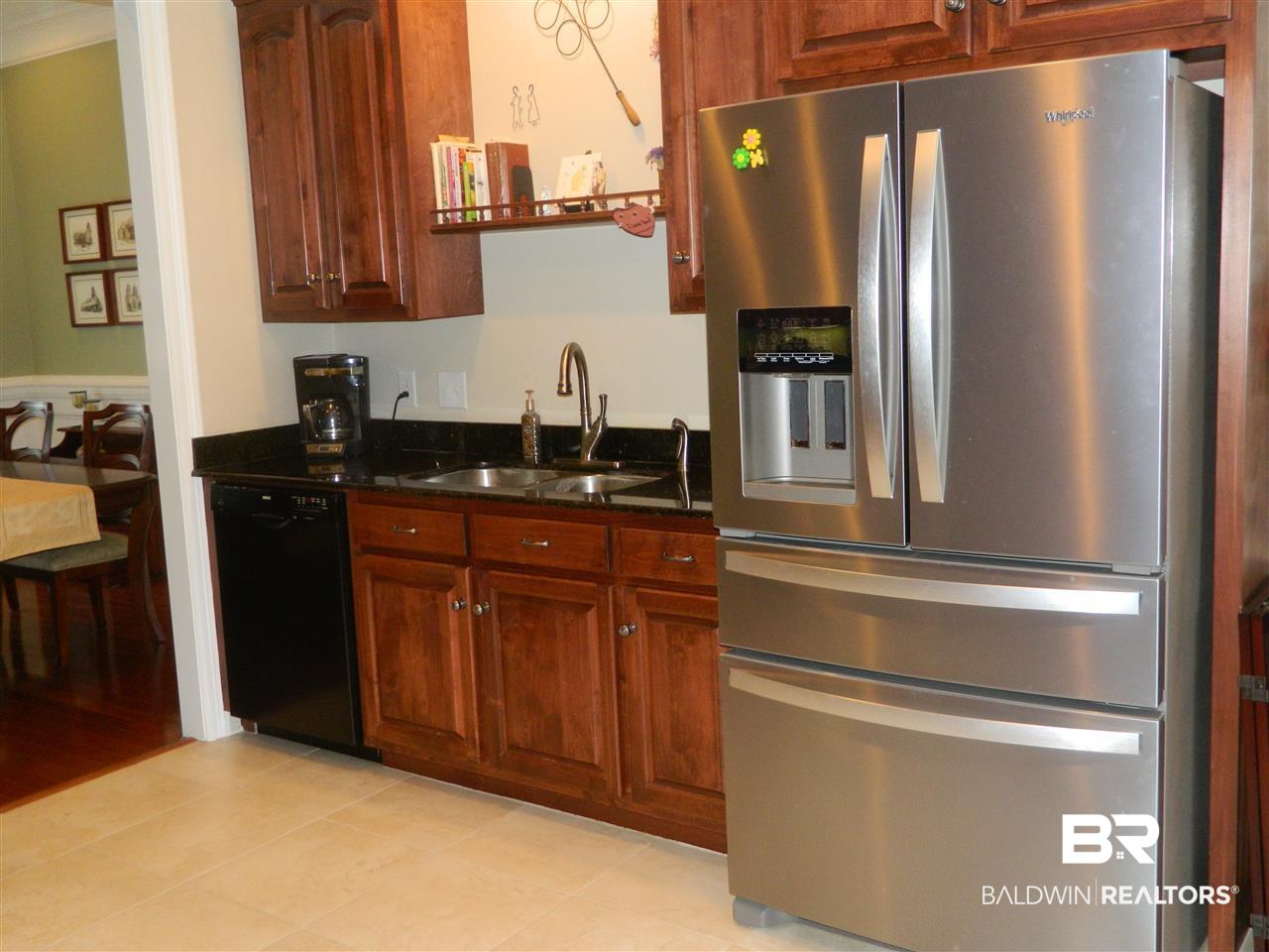3990 Symphony Way West Semmes, AL 36575 - Photo 14 of 45 The 18" porecelain tile a plus, & refrigerator.