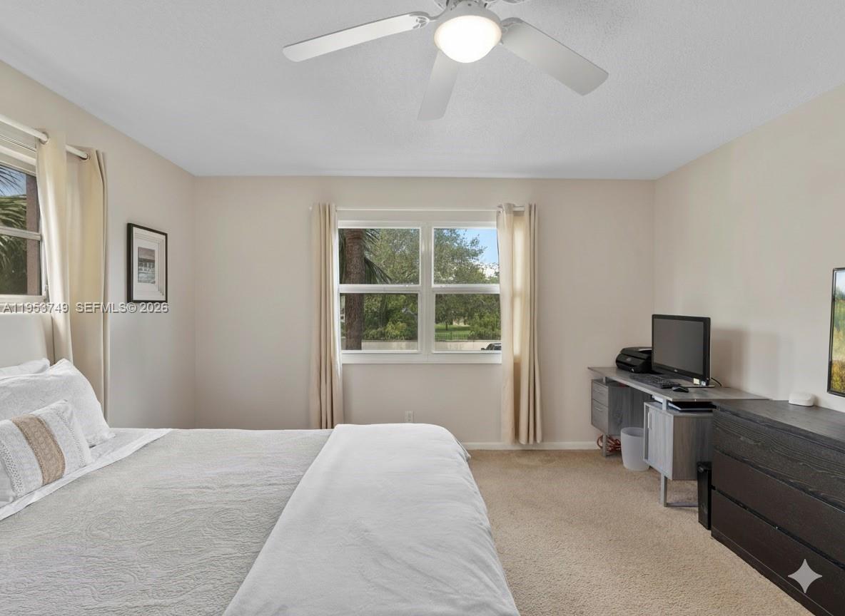 2004 Granada Drive, Unit O2 Coconut Creek, FL 33066 - Photo 15 of 26 a bedroom with a bed and a window