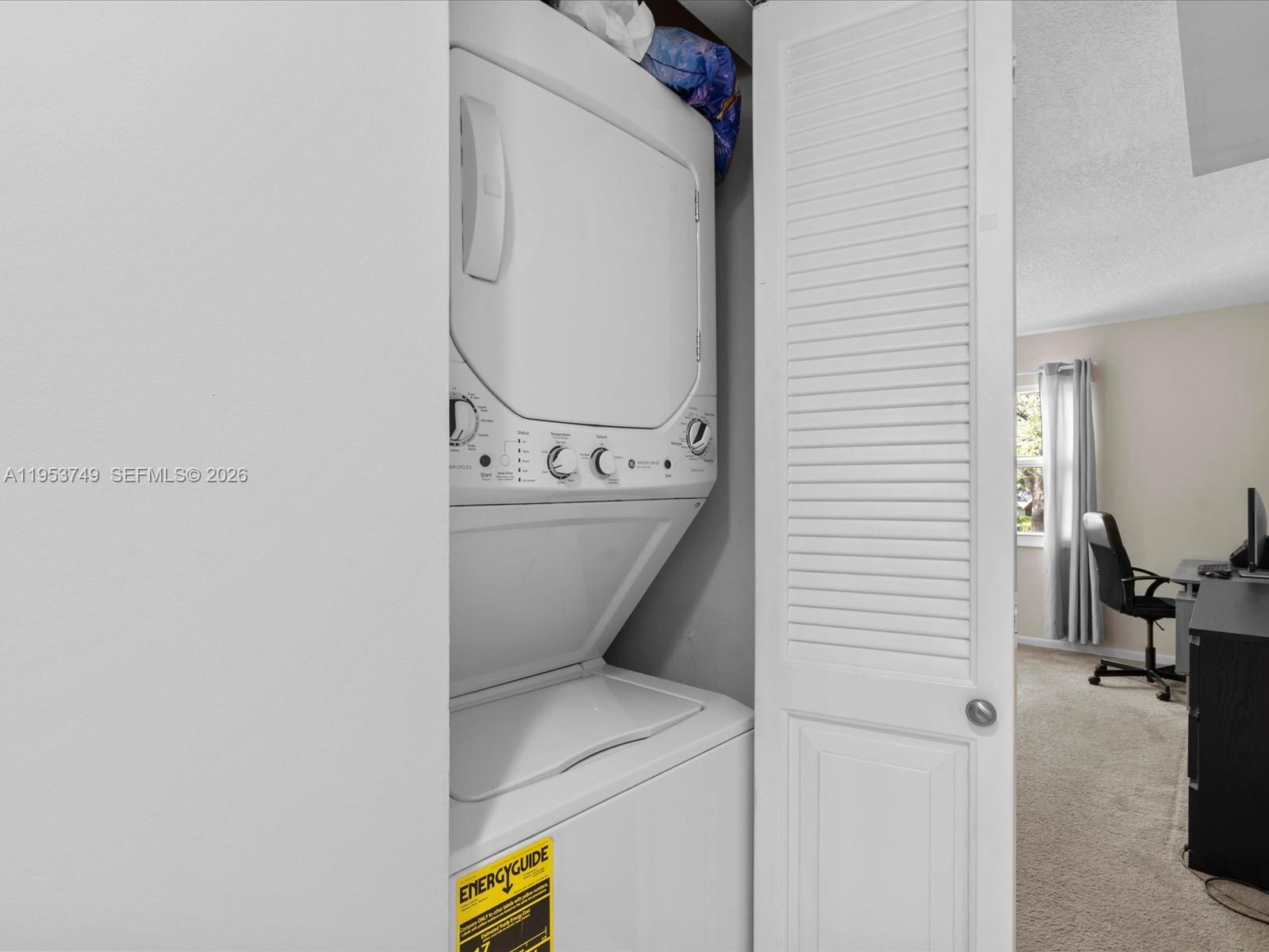 2004 Granada Drive, Unit O2 Coconut Creek, FL 33066 - Photo 17 of 26 a utility room with dryer and washer