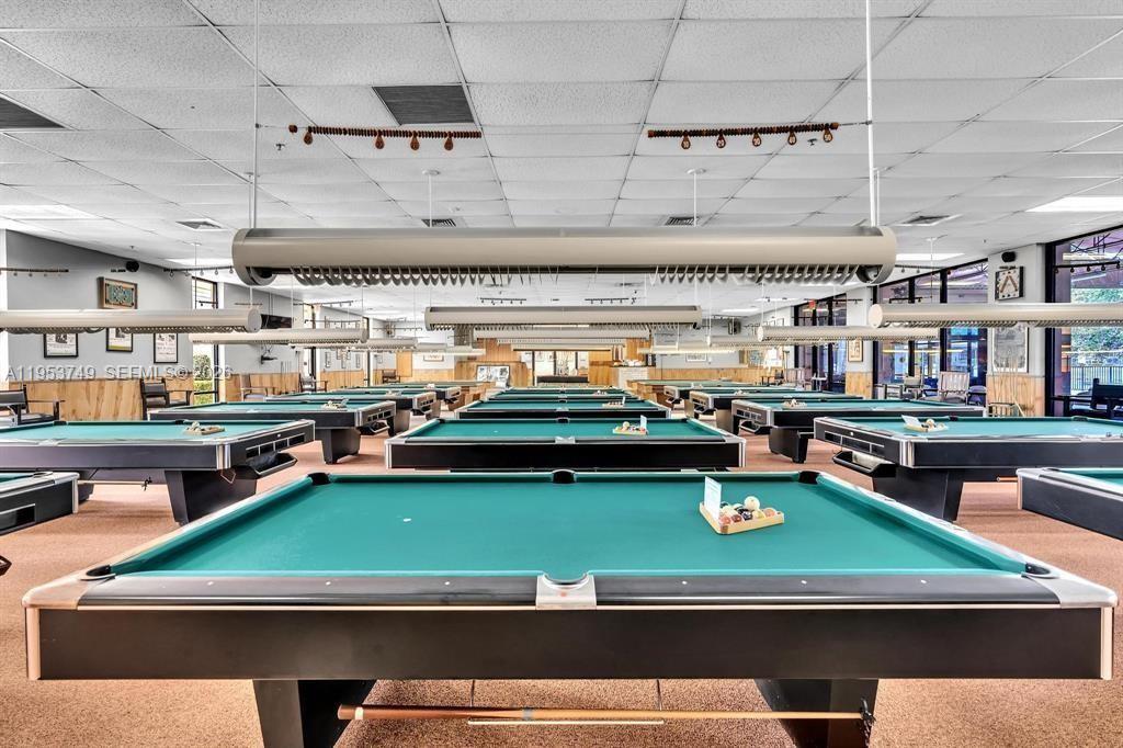 2004 Granada Drive, Unit O2 Coconut Creek, FL 33066 - Photo 24 of 26 a room with lots of tables and chairs