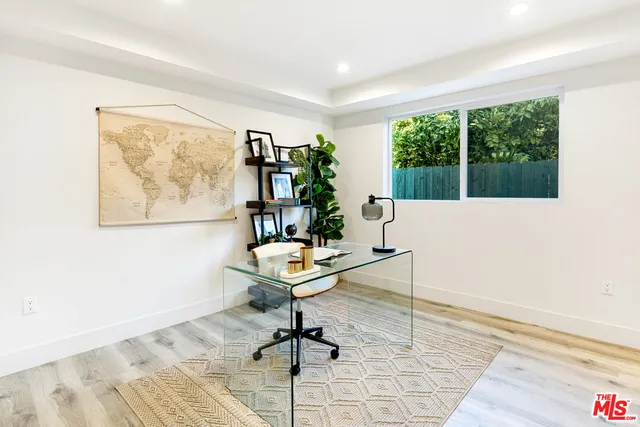 a workspace with furniture and a window