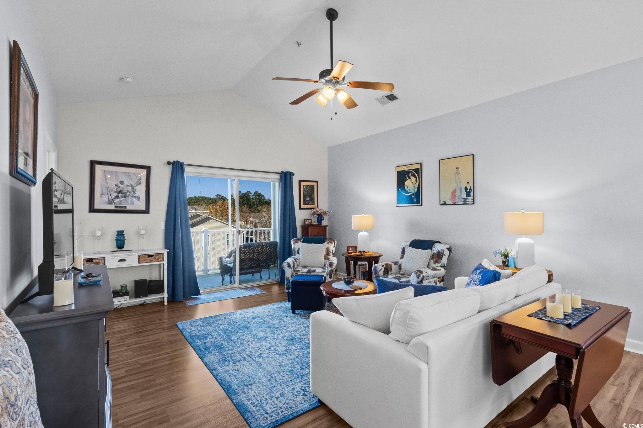 336 Kiskadee Loop, Unit 19O Conway, SC 29526 - Photo 7 of 26 Living area featuring high vaulted ceiling, wood finished floors, and ceiling fan