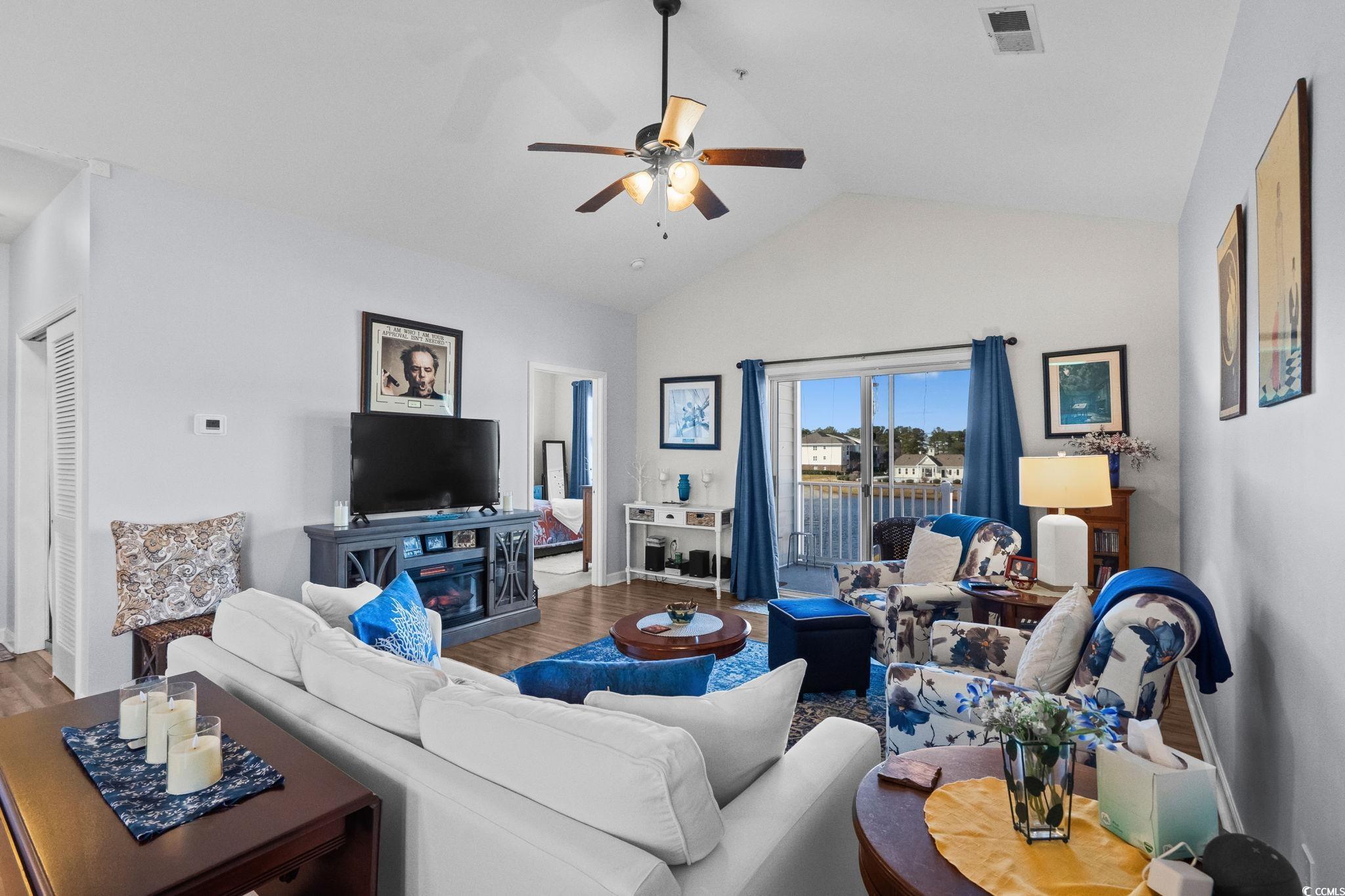 336 Kiskadee Loop, Unit 19O Conway, SC 29526 - Photo 7 of 20 Living room featuring ceiling fan, wood finished floors, and high vaulted ceiling