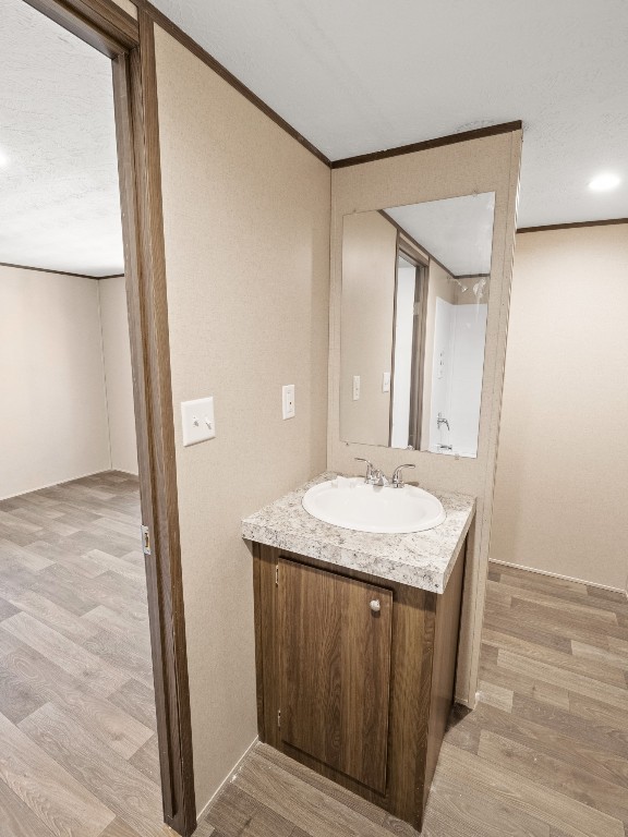7214 Comstock Cove Lago Vista, TX 78645 - Photo 14 of 20 a bathroom with a granite countertop sink and a mirror