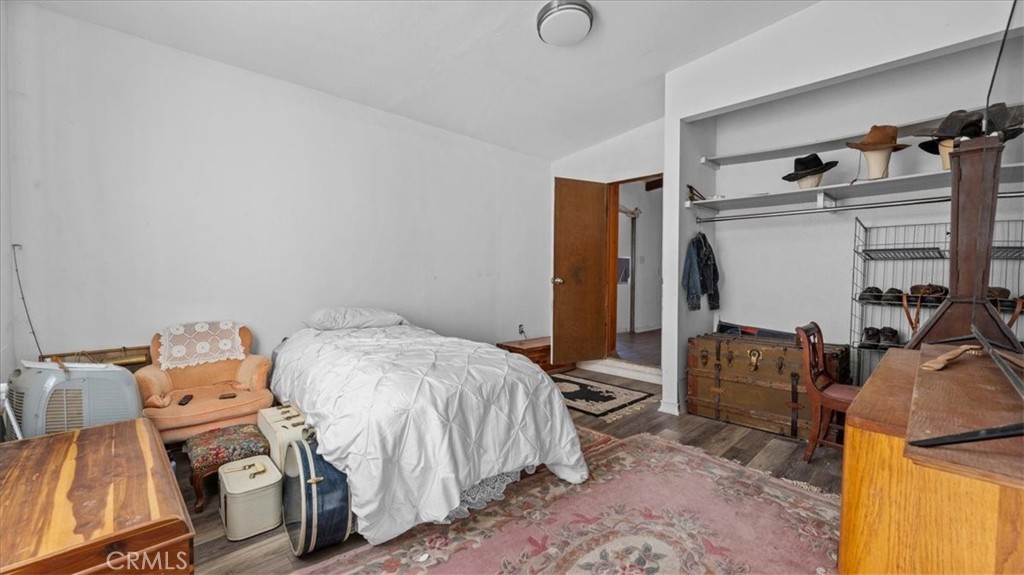 9728 East Avenue R Littlerock, CA 93543 - Photo 14 of 37 a bed room with a bed and a television