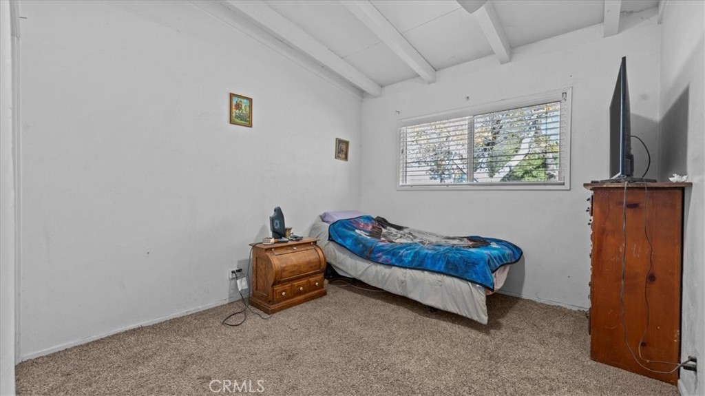 9728 East Avenue R Littlerock, CA 93543 - Photo 16 of 37 a room with furniture and a flat screen tv