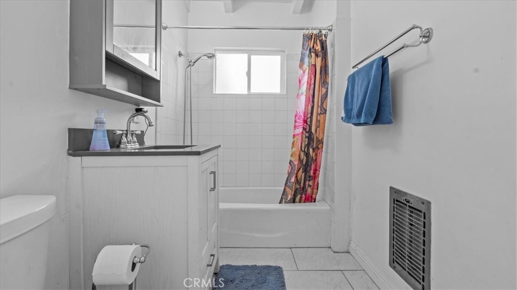 9728 East Avenue R Littlerock, CA 93543 - Photo 17 of 37 a bathroom with a sink a toilet and mirror