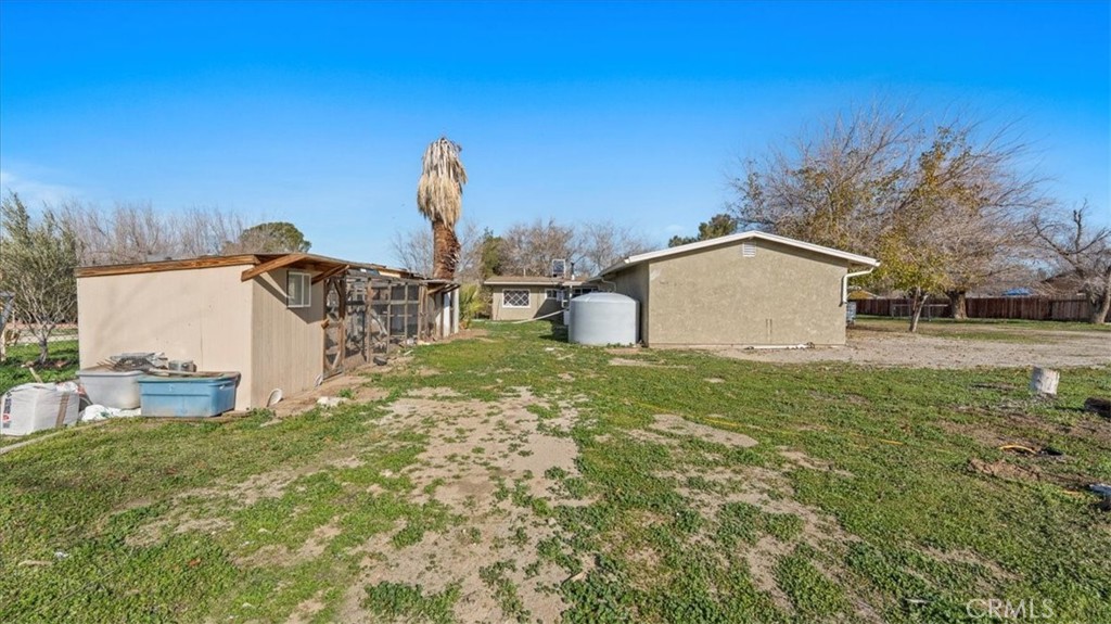 9728 East Avenue R Littlerock, CA 93543 - Photo 27 of 37 a view of a backyard with large trees