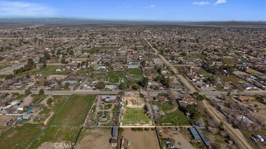 9728 East Avenue R Littlerock, CA 93543 - Photo 37 of 37 an aerial view of residential building with parking space