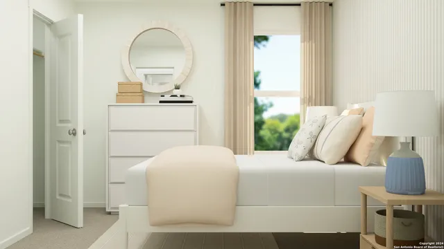 a bedroom with a bed and a mirror