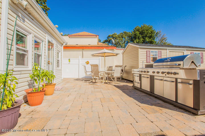623 Bancroft Road Brick, NJ 08724 - Photo 23 of 91 a view of a patio with table and chairs potted plants